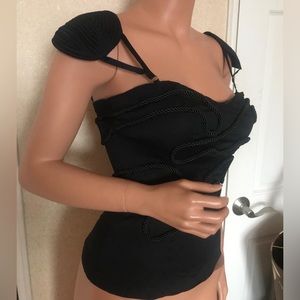 Bebe black corset top with shoulder pads, rope detailing, & zipper in the back.